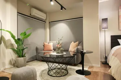 a living room with a couch and a table at 9STAY Shibuya Shinsen in Tokyo
