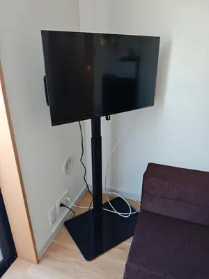 a flat screen tv on a stand in a room at \u30e1\u30ea\u30b9\u6c60\u888bEast 402 in Tokyo