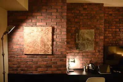 a brick wall with a picture on it at Hotel Risveglio Akasaka in Tokyo