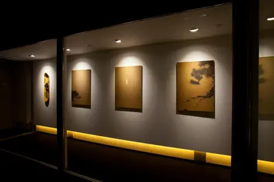 a room with paintings on the wall in a museum at Hotel Risveglio Akasaka in Tokyo