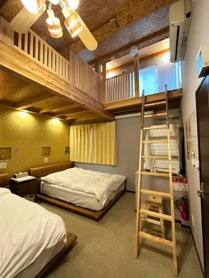 a bunk bed room with two beds and a ladder at KAKURE Jujo 7min Ikebukuro 11min Shinjuku 16min Shibuya Walk to Jujo & Itabashi-Honcho ,Up to 5 Guests in Tokyo
