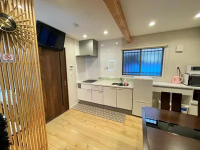 a kitchen with white cabinets and a counter top at KAKURE Jujo 7min Ikebukuro 11min Shinjuku 16min Shibuya Walk to Jujo & Itabashi-Honcho ,Up to 5 Guests in Tokyo