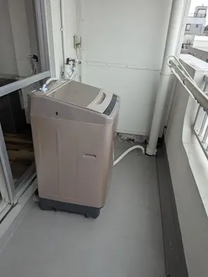 a washing machine in a room with a sink at A nostalgic Japanese atmosphere in Shibuya in Tokyo