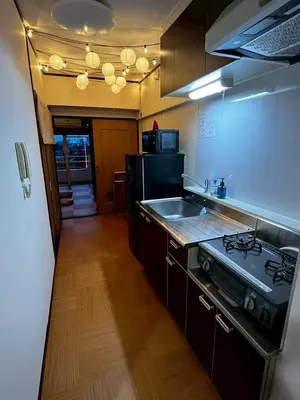 a kitchen with a stove and a sink in it at A nostalgic Japanese atmosphere in Shibuya in Tokyo