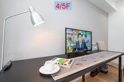 a desk with a computer and a monitor on it at Riverview APT, Asakusa-Skytree area, 4 min to Metro in Tokyo