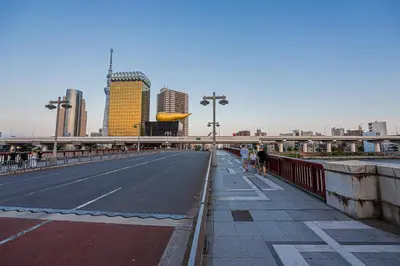 a bridge over a street in a city with buildings at Riverview APT, Asakusa-Skytree area, 4 min to Metro in Tokyo