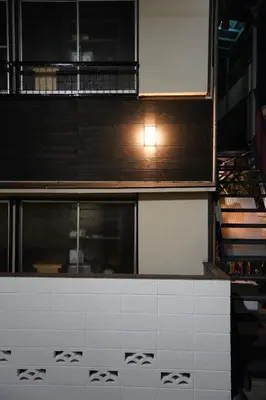 a kitchen with a counter top with a window at tonema in Tokyo