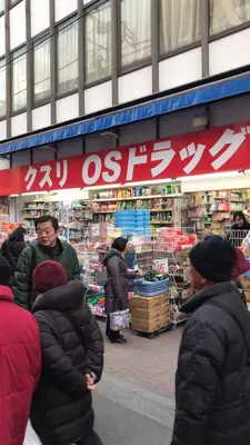 a group of people standing in front of a store at Sweet House Sugamo 101 in Tokyo