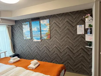 a room with a bed and three windows at Yui Asakusa-MIYABI 702 City-Center Luxury Stay-Walk to Asakusa in Tokyo