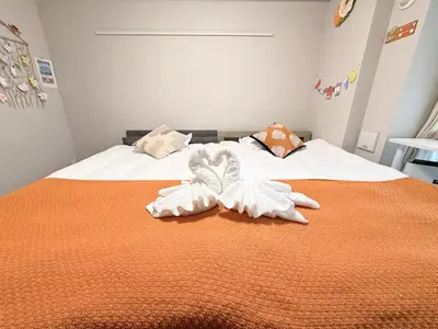 a bedroom with a bed with towels on it at Yui Asakusa-MIYABI 702 City-Center Luxury Stay-Walk to Asakusa in Tokyo