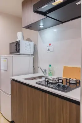 a kitchen with a sink and a refrigerator at Yui Asakusa-MIYABI 702 City-Center Luxury Stay-Walk to Asakusa in Tokyo