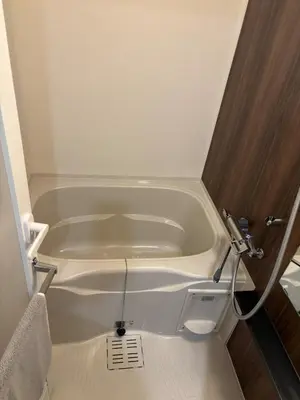 a white bath tub in a small bathroom at Yui Asakusa-MIYABI 702 City-Center Luxury Stay-Walk to Asakusa in Tokyo