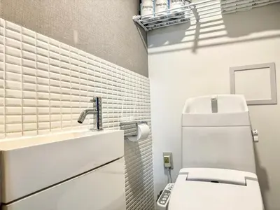 a bathroom with a white toilet and a sink at Roppongi 3min Walk, Shinjuku 10min,Shibuya 15min, Tokyo Tower 58sqm for 6 in Tokyo