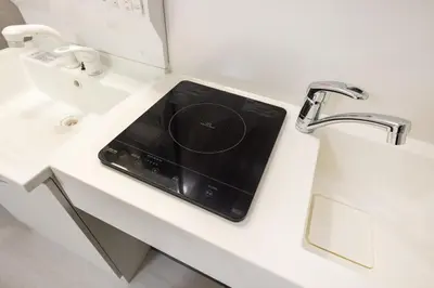 a tablet sitting on a bathroom counter next to a sink at Roppongi 3min Walk, Shinjuku 10min,Shibuya 15min, Tokyo Tower 58sqm for 6 in Tokyo