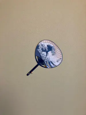 a magnifying glass with a picture of the earth at Realization INN Horikiri in Tokyo