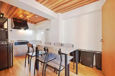 a kitchen with a table and chairs in a room at V Close to Shinjuku Kabukicho Korean Town FrWIFI B in Tokyo