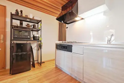 a kitchen with a stove and a microwave at V Close to Shinjuku Kabukicho Korean Town FrWIFI B in Tokyo