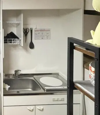 a kitchen with a sink and a counter with utensils at Mie's House Skytree 美英軒 in Tokyo