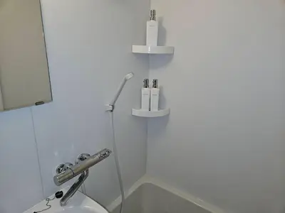 a white bathroom with a sink and a bath tub at \u30db\u30c6\u30eb\u30ec\u30b9\u30dd\u30ef\u30fc\u30eb401 in Tokyo