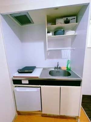 a small kitchen with a sink in a room at M-house in Tokyo