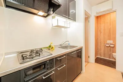 a kitchen with a sink and a stove at 101 6-min walk from Higashi-Jūjō Station Cozy 1-Bedroom Apartment Direct Access to Akihabara & Ueno in Tokyo