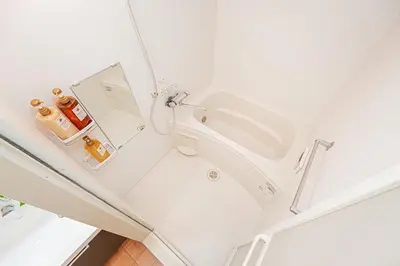 a white bathroom with a sink and a mirror at 101 6-min walk from Higashi-Jūjō Station Cozy 1-Bedroom Apartment Direct Access to Akihabara & Ueno in Tokyo