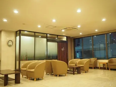a waiting room with chairs and tables and windows at Smile Hotel Tokyo Shinkoiwa - Vacation STAY 82190v in Tokyo