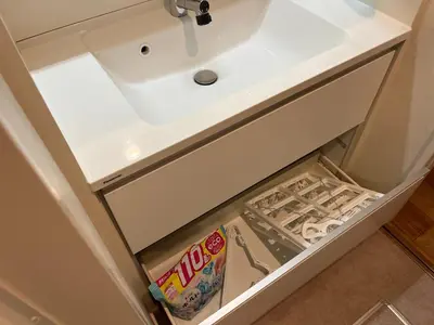an open drawer in a bathroom vanity with a sink at YOYOGIHOUSE - Vacation STAY 19984 in Tokyo