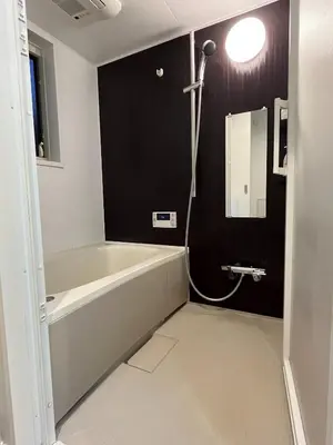 a bathroom with a bath tub and a mirror at YOYOGIHOUSE - Vacation STAY 19984 in Tokyo