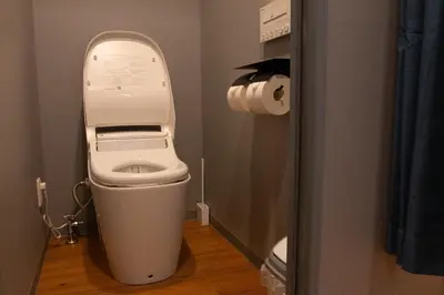 a bathroom with a toilet with the lid up at ECORO Shinjuku Dai2 Building 2F - Vacation STAY 20114 in Tokyo