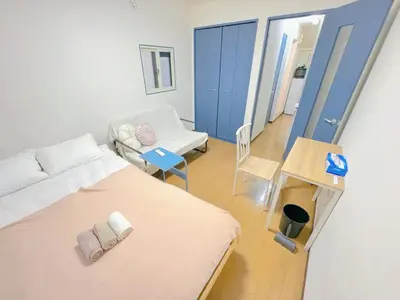 a hospital room with a bed and a chair at TD House 3-min Walk Easy Access Shinjuku, Shibuya, Asakusa, Ueno in Tokyo