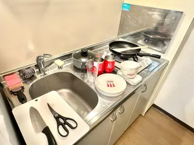 a kitchen counter with a sink and a stove at TD House 3-min Walk Easy Access Shinjuku, Shibuya, Asakusa, Ueno in Tokyo