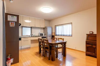 a kitchen and dining room with a table and chairs at SHINJUKU Garden-house in Tokyo