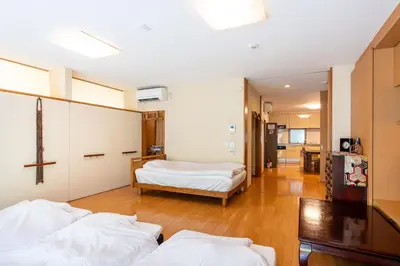 a room with two beds and a room with a room at SHINJUKU Garden-house in Tokyo