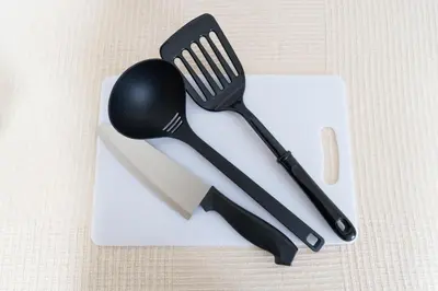 a black spoon and fork on a white plate at Sakura Stays Tokyo - Stay Together with Privacy - Ideal Group Accommodation in Tokyo
