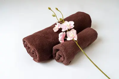 a brown towel with pink flowers on it at Sakura Stays Tokyo - Stay Together with Privacy - Ideal Group Accommodation in Tokyo