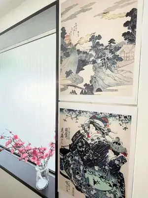 a room with a mirror and a wall with paintings at Sakura Stays Tokyo - Stay Together with Privacy - Ideal Group Accommodation in Tokyo