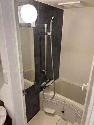 a bathroom with a shower and a bath tub at 41 \u3068\u308a\u3063\u3071\u30fc\u305a\u30db\u30c6\u30eb\u9ad8\u7530\u99ac\u5834 in Tokyo