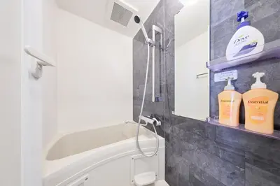 a bathroom with a sink and a toilet and some bottles at 41 \u3068\u308a\u3063\u3071\u30fc\u305a\u30db\u30c6\u30eb\u9ad8\u7530\u99ac\u5834 in Tokyo