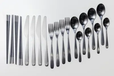 a group of silver spoons and forks and knives at KOKOON Hotel Shibuya 201 in Tokyo