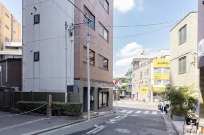an empty street in a city with buildings at KOKOON Hotel Shibuya 201 in Tokyo