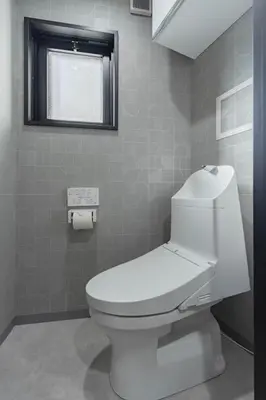 a bathroom with a white toilet and a window at KOKOON Hotel Shibuya 301 in Tokyo