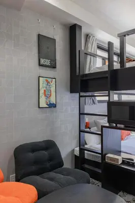 a living room with a bunk bed and a couch at KOKOON Hotel Shibuya 301 in Tokyo