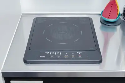 a tablet computer sitting on top of a stove at KOKOON Hotel Shibuya 401 in Tokyo