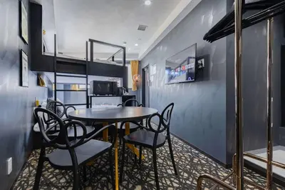 a dining room with a table and chairs at KOKOON Hotel Shibuya 401 in Tokyo