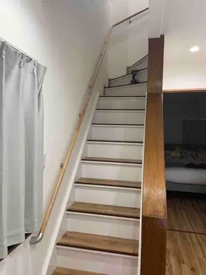 a staircase in a room with a bed at \u30b2\u30b9\u30c8\u30cf\u30a6\u30b9\u66f3\u821f in Tokyo