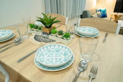 a wooden table with blue and white plates on it at \u30b2\u30b9\u30c8\u30cf\u30a6\u30b9\u66f3\u821f in Tokyo