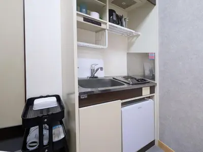 a small kitchen with a sink and a dishwasher at East-Nihonbashi House 2bed Travel Work in Tokyo