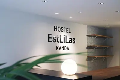 a room with a sign that reads hosteles kaho at \u30db\u30b9\u30c6\u30eb\u30a8\u30ea\u30fc\u30e9\u795e\u7530 HOSTEL EstLiLas KANDA in Tokyo