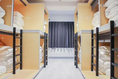 a walk in closet with shelves of cheese at \u30db\u30b9\u30c6\u30eb\u30a8\u30ea\u30fc\u30e9\u795e\u7530 HOSTEL EstLiLas KANDA in Tokyo